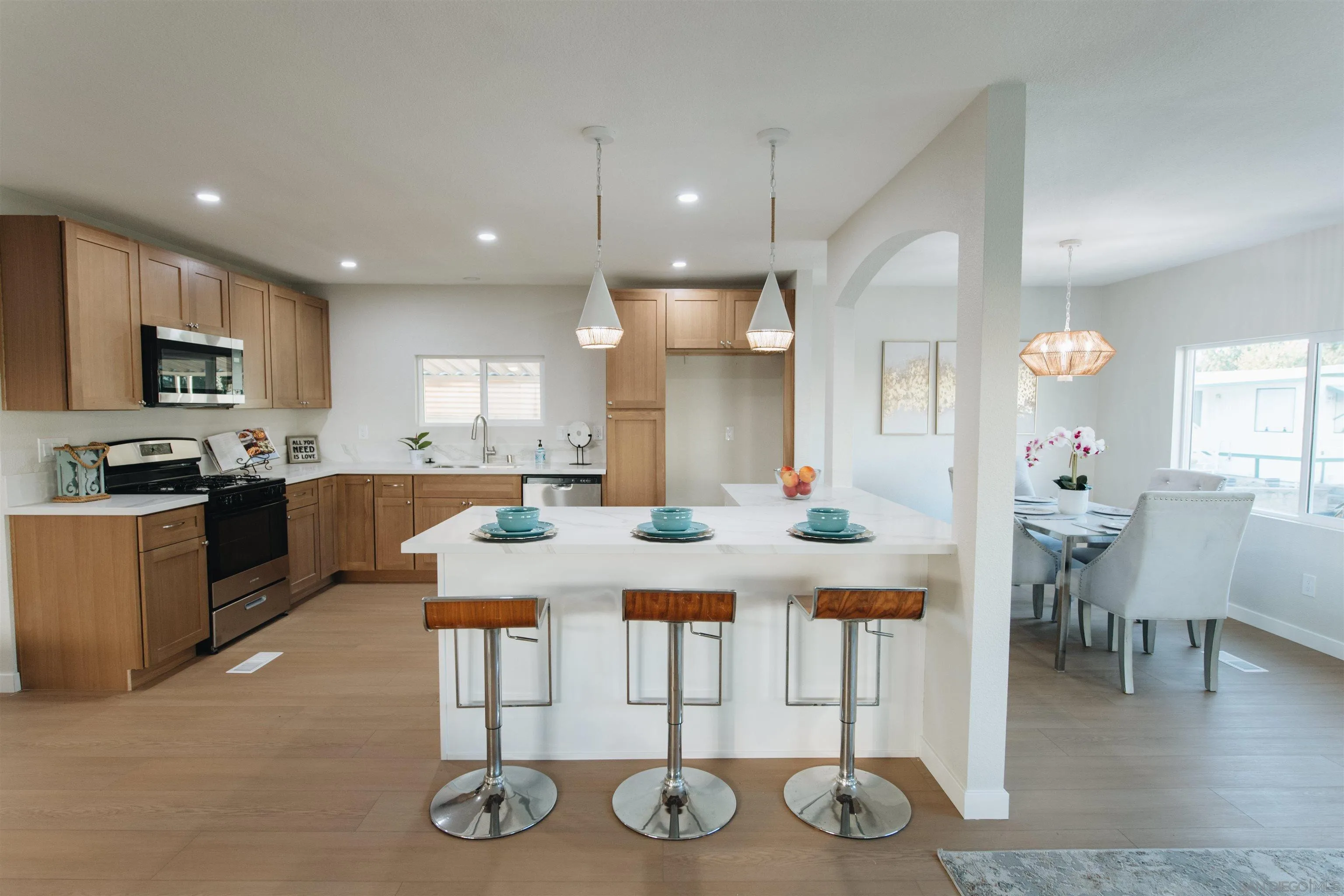2400 Alpine Boulevard, Unit 8 Alpine, CA 91901 - Photo 14 of 26 a large kitchen with cabinets a sink a counter space and stainless steel appliances