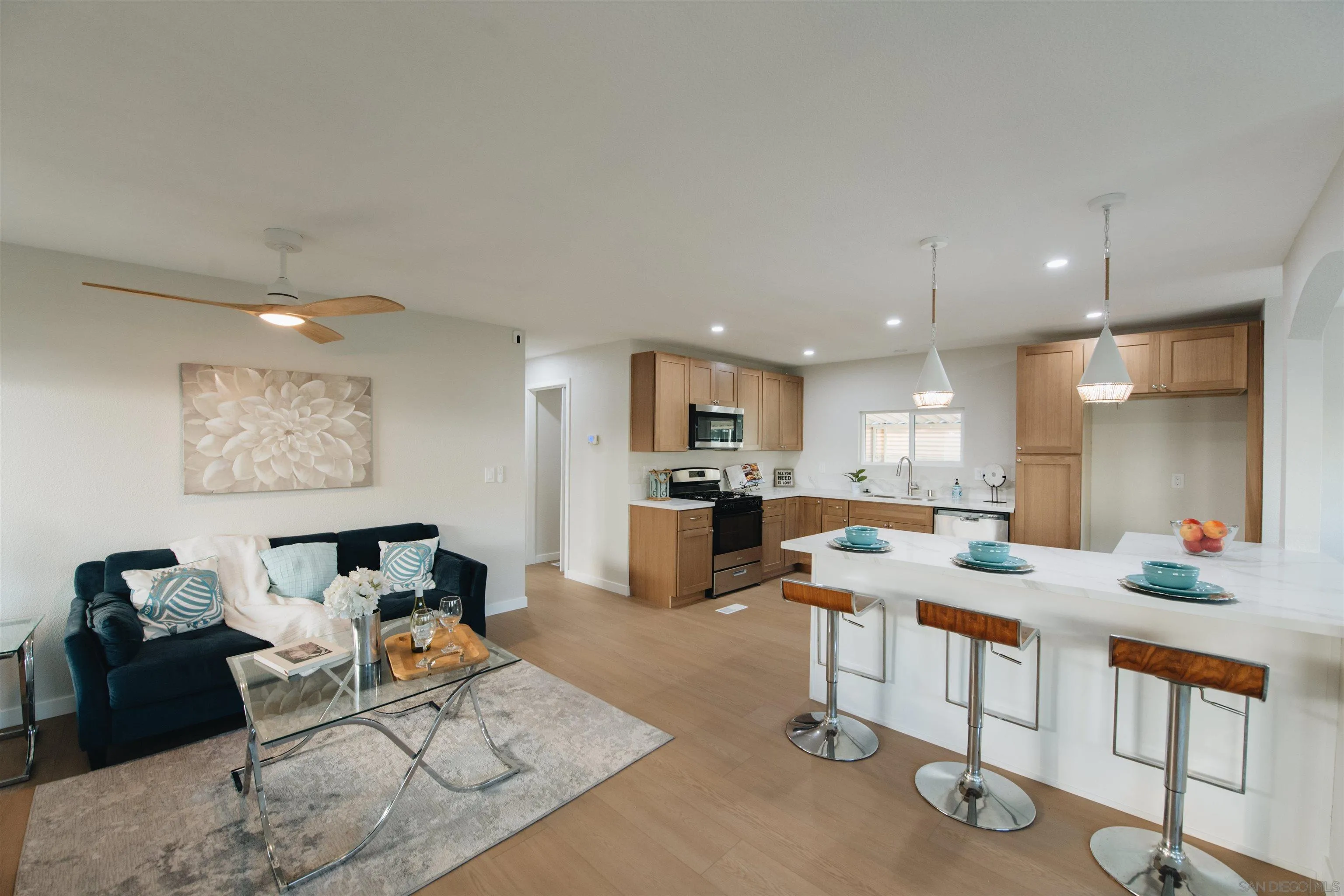 2400 Alpine Boulevard, Unit 8 Alpine, CA 91901 - Photo 16 of 26 a living room with furniture kitchen view and a table