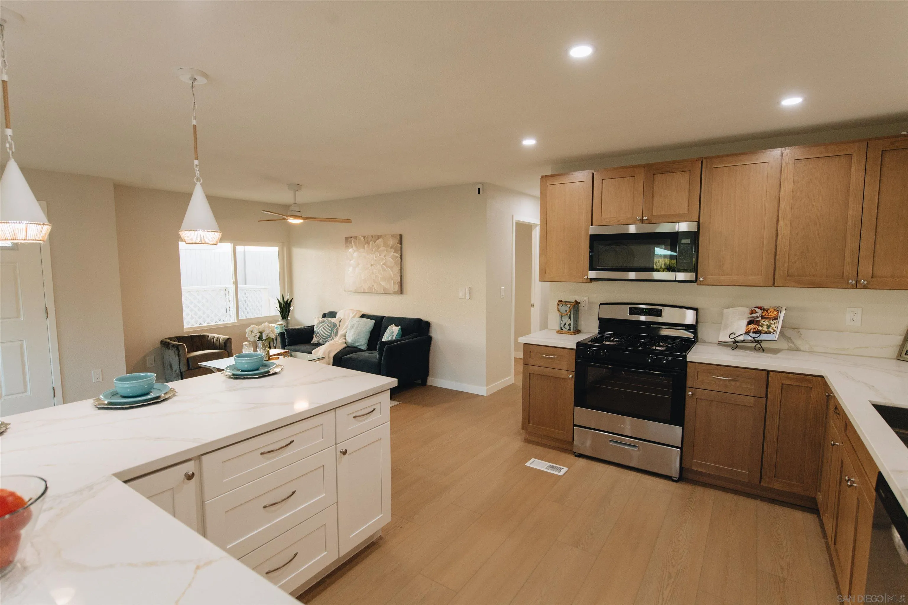 2400 Alpine Boulevard, Unit 8 Alpine, CA 91901 - Photo 21 of 26 a kitchen with stainless steel appliances white cabinets sink and stove