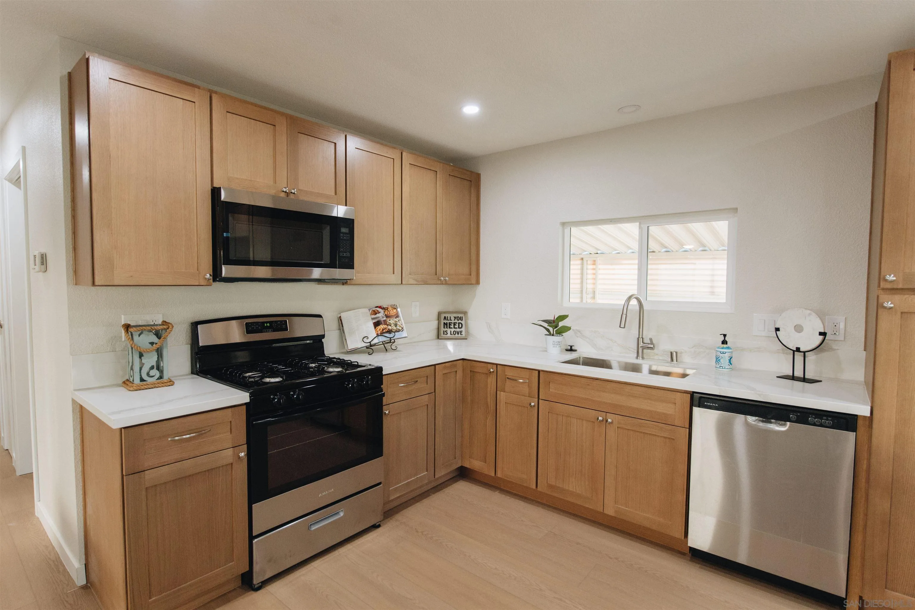 2400 Alpine Boulevard, Unit 8 Alpine, CA 91901 - Photo 22 of 26 a kitchen with a sink stove and microwave