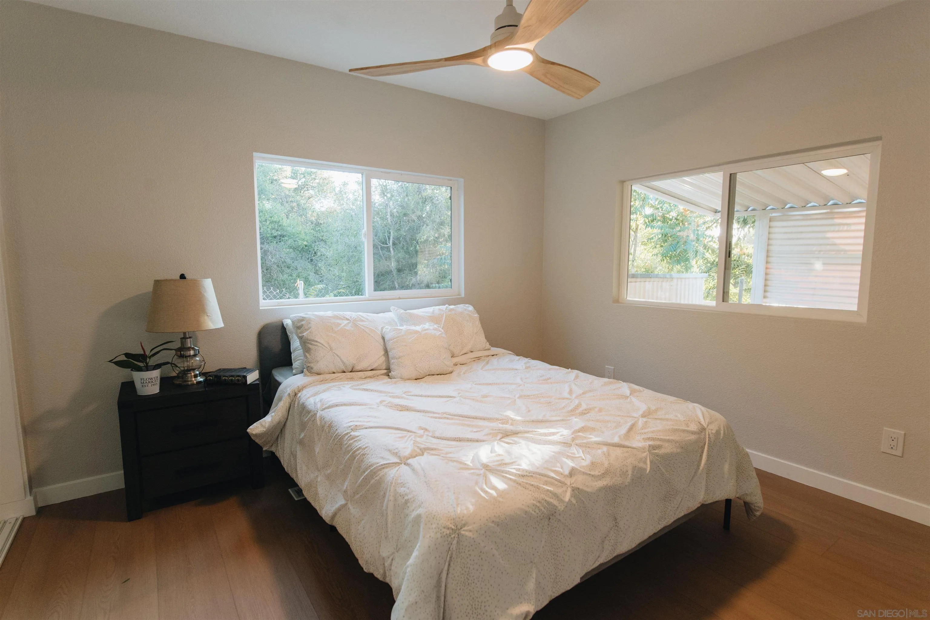 2400 Alpine Boulevard, Unit 8 Alpine, CA 91901 - Photo 23 of 26 a bedroom with a bed and a tv