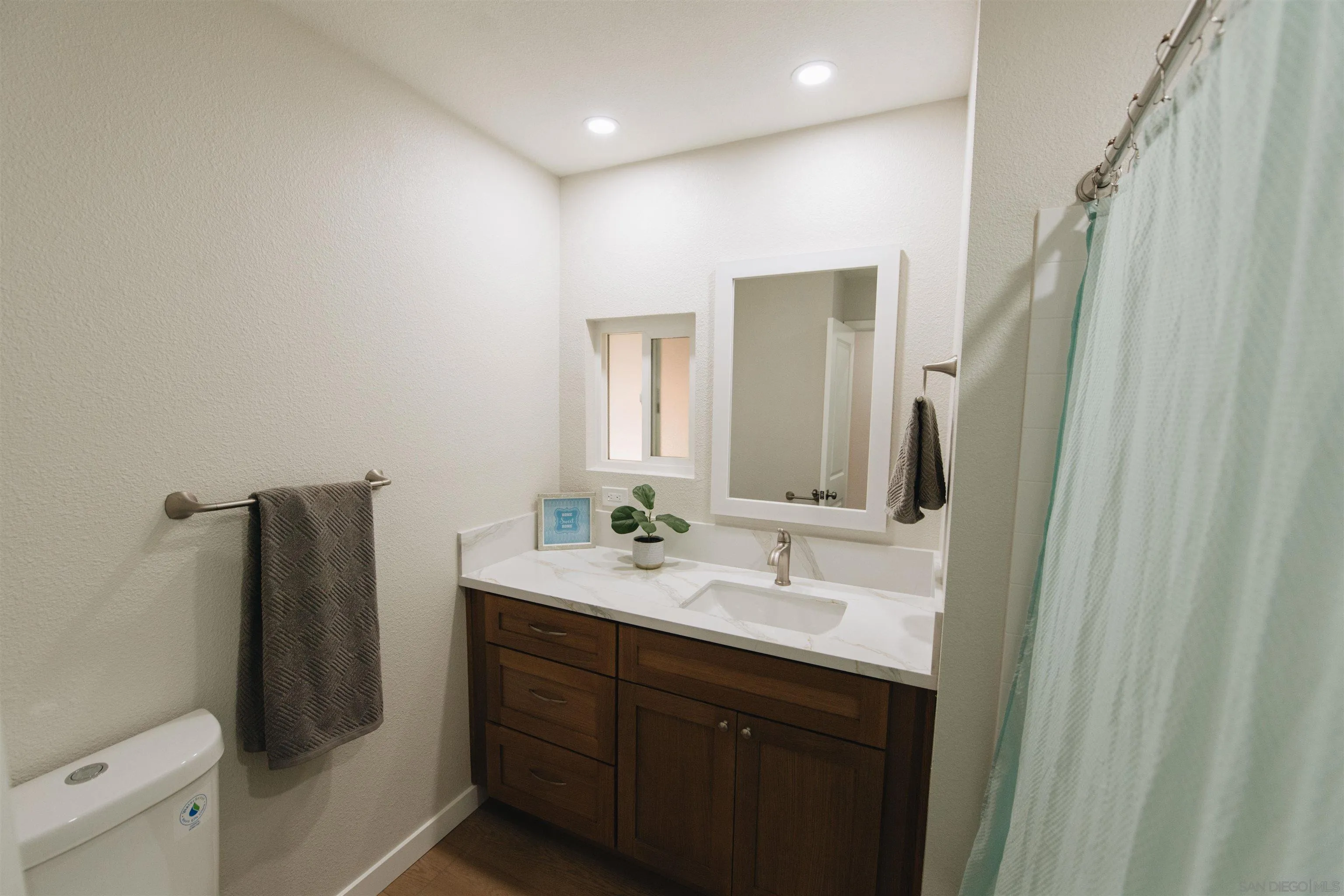 2400 Alpine Boulevard, Unit 8 Alpine, CA 91901 - Photo 5 of 26 a bathroom with double vanity and a mirror