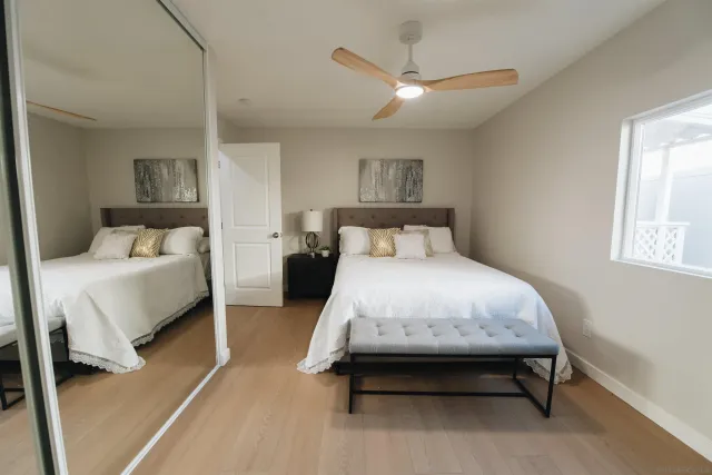 a spacious bedroom with a bed and window