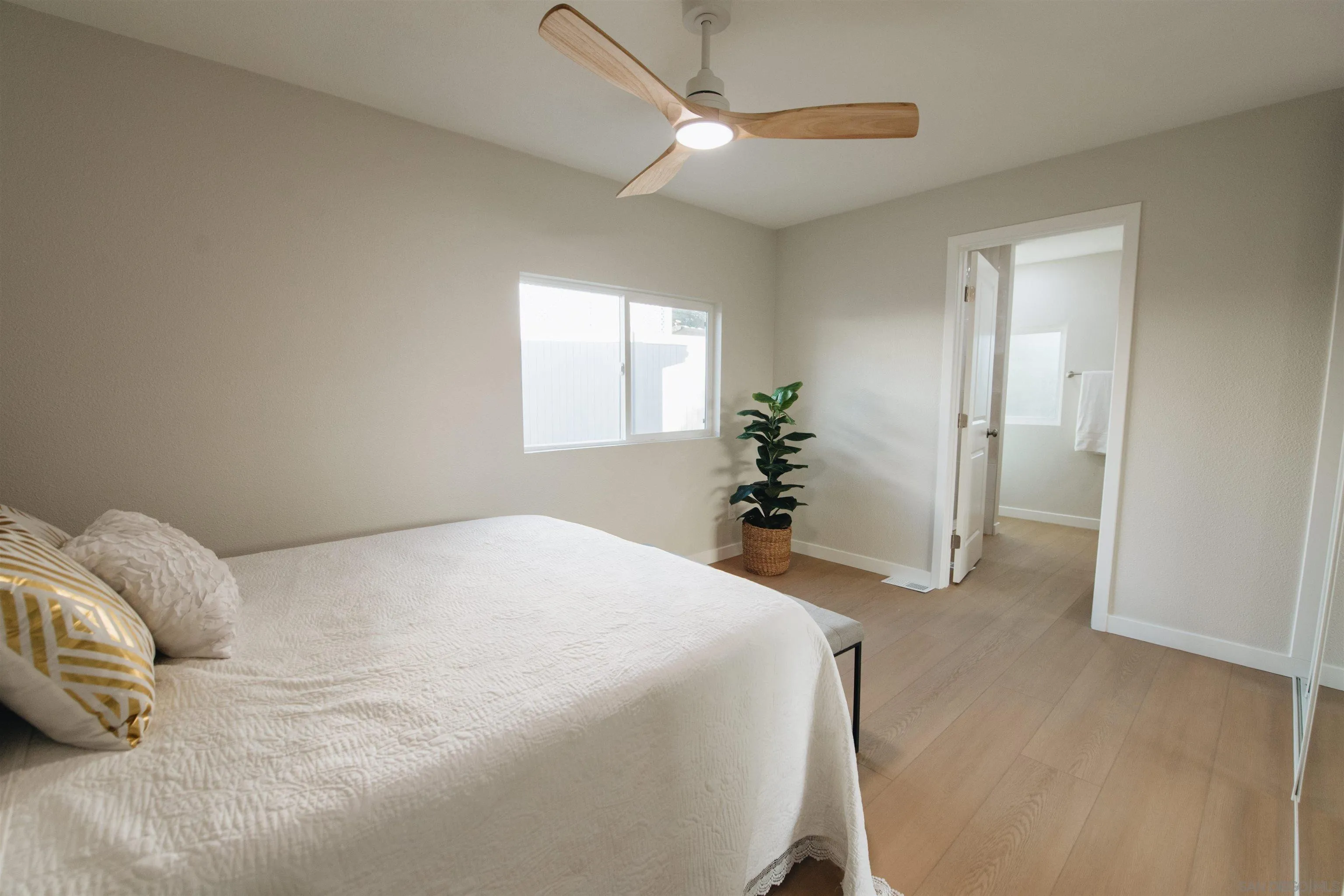 2400 Alpine Boulevard, Unit 8 Alpine, CA 91901 - Photo 7 of 26 a bed room with a bed and a chandelier