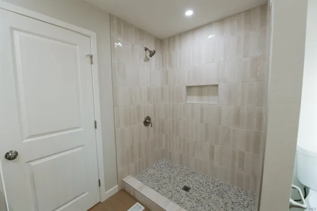 a bathroom with a shower and a sink