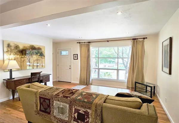 a bed room with a bed and a window