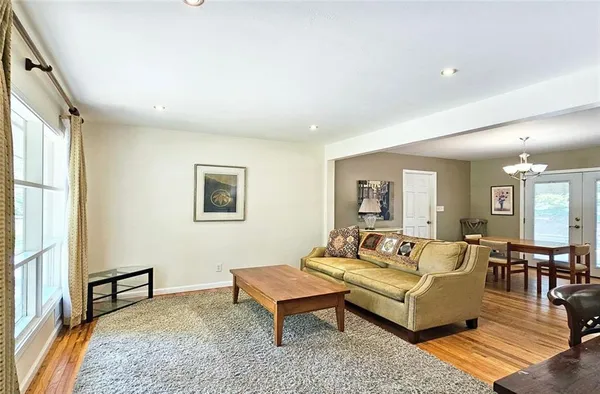 a living room with furniture and a rug