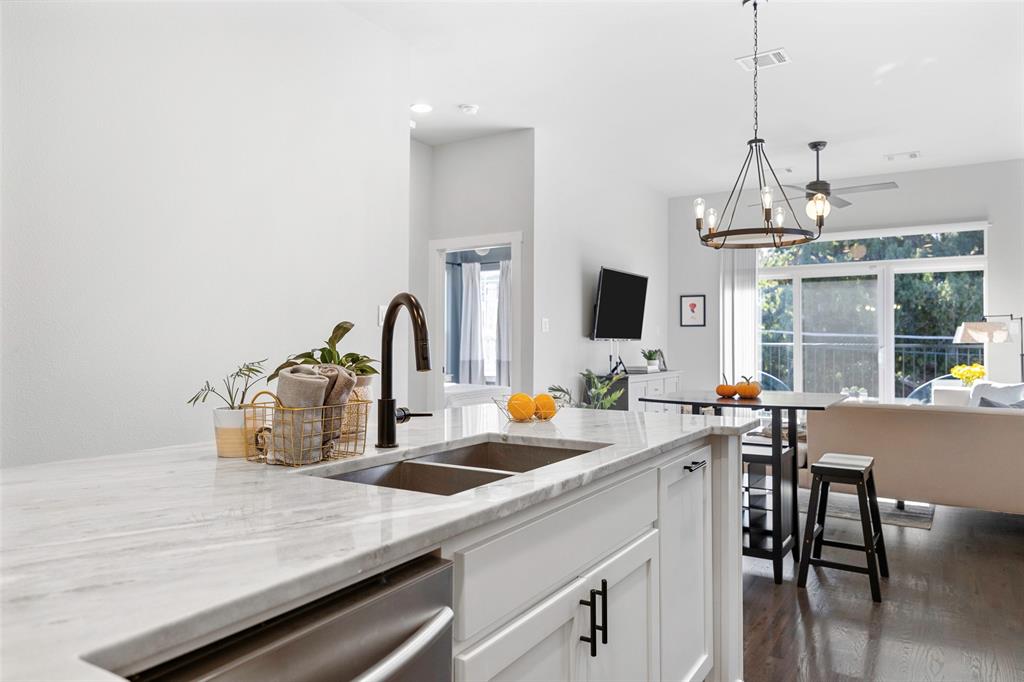 312 North Henderson Avenue, Unit 1 Dallas, TX 75214 - Photo 15 of 25 a kitchen with sink cabinets and dining table