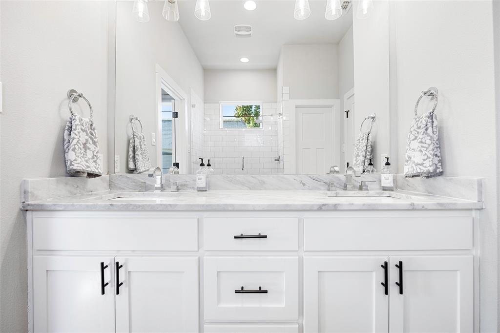 312 North Henderson Avenue, Unit 1 Dallas, TX 75214 - Photo 18 of 25 a bathroom with a sink vanity and a mirror