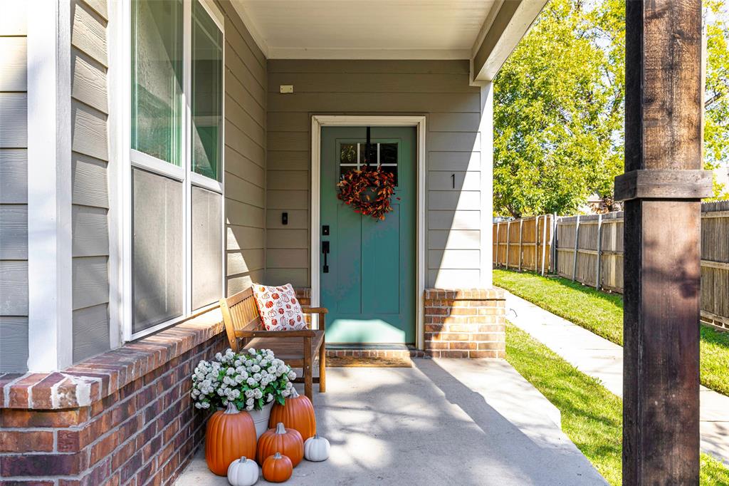 312 North Henderson Avenue, Unit 1 Dallas, TX 75214 - Photo 2 of 25 a view of a porch with chairs and potted plants