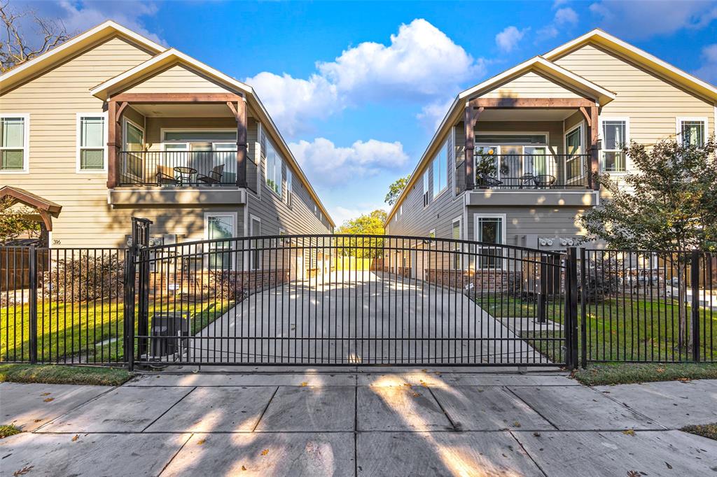 312 North Henderson Avenue, Unit 1 Dallas, TX 75214 - Photo 24 of 25 a view of a house with a wooden fence