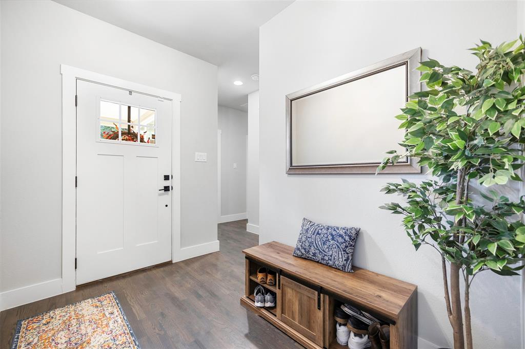 312 North Henderson Avenue, Unit 1 Dallas, TX 75214 - Photo 3 of 25 a view of a hallway with wooden floor and a potted plant