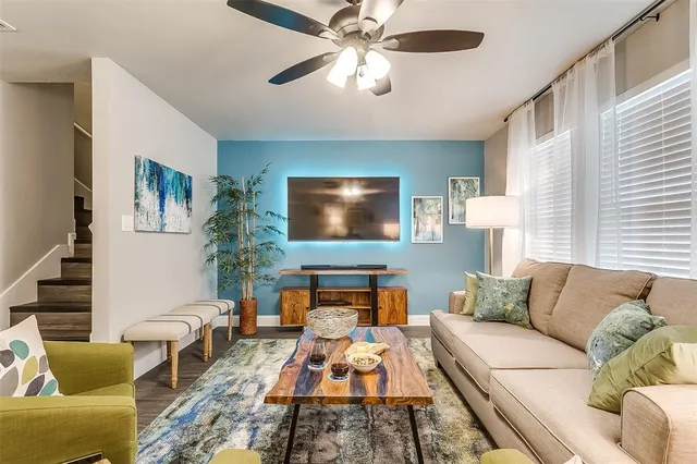 a living room with furniture and a flat screen tv