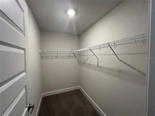 a view of a room with racks on the wall