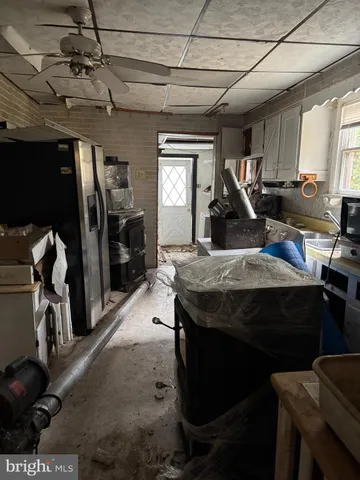 a view of a livingroom with furniture and a window