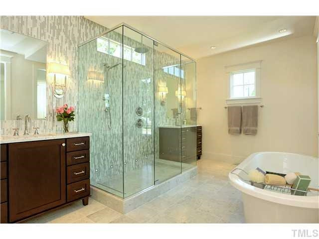 816 Wayne Drive Raleigh, NC 27608 - Photo 2 of 3 a bathroom with a sink mirror and shower