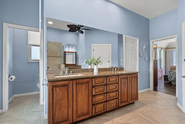 a kitchen with kitchen island a sink appliances and cabinets