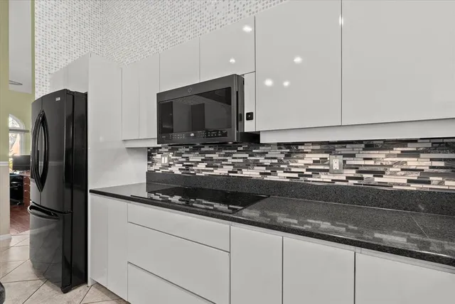 a bedroom with a bed and a mirror