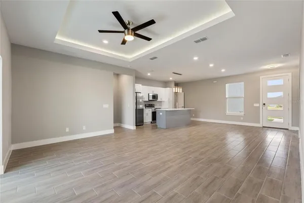 a view of a kitchen with a sink and a window