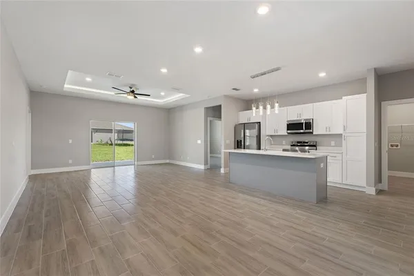 a view of kitchen with cabinets and wooden floor