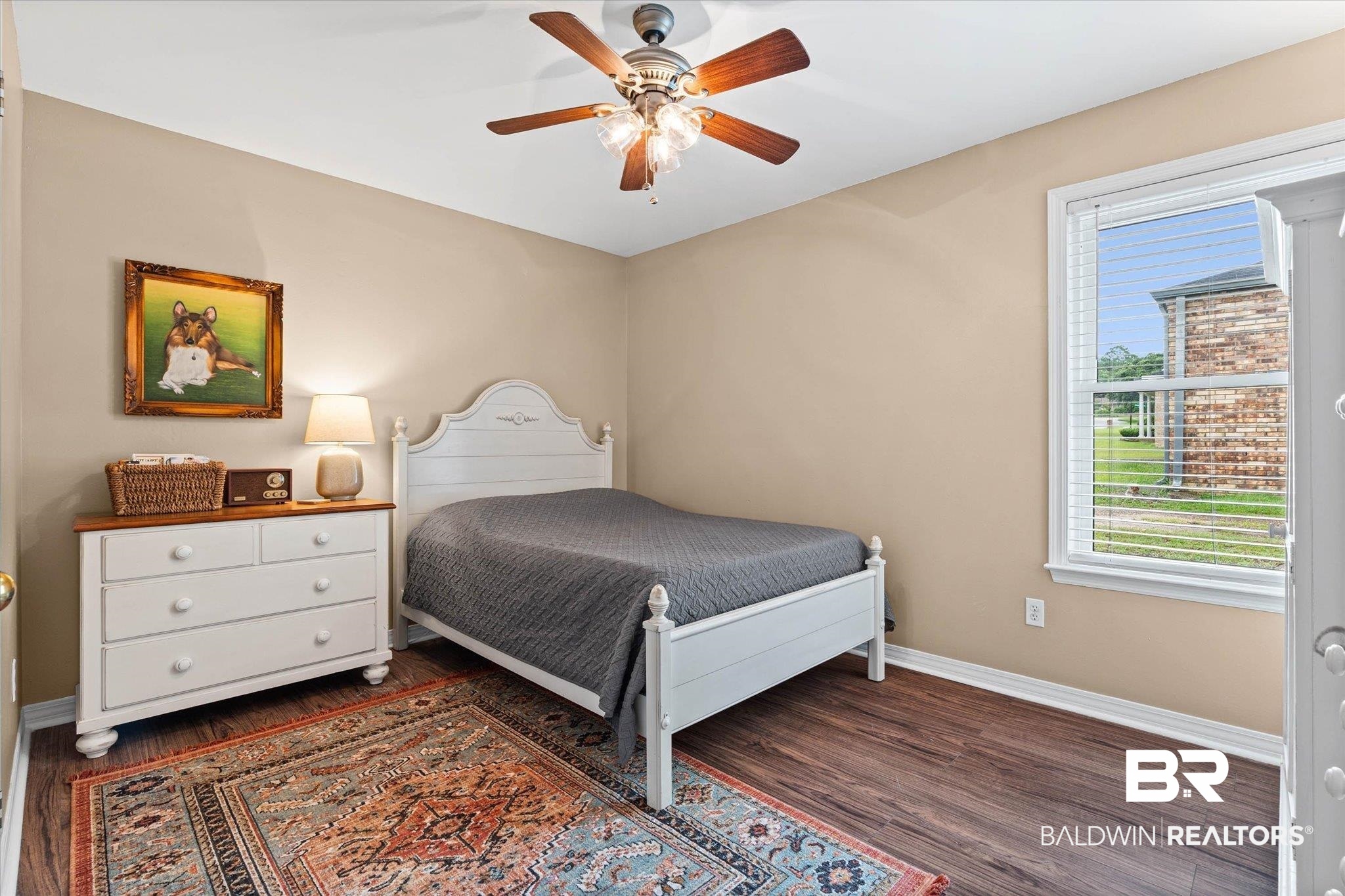 6501 Gas Light Lane South Mobile, AL 36695 - Photo 14 of 23 Room with wood-finish flooring, neutral wall paint, and a white trim package