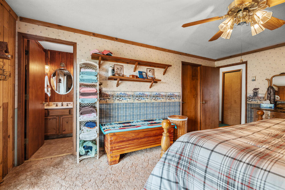 47477 Gerber Road Bonanza, OR 97623 - Photo 50 of 63 a bedroom with a bed and a chandelier