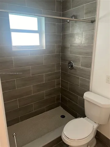 a bathroom with a toilet and a sink