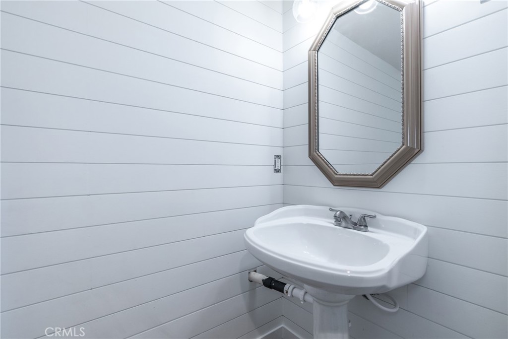 10870 Santa Ana Road Atascadero, CA 93422 - Photo 27 of 67 The half bathroom has shiplap walls and a stylish barn door.