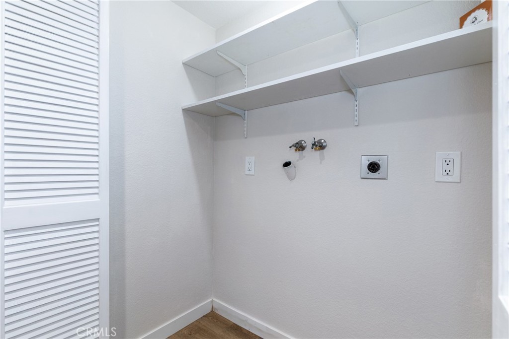 10870 Santa Ana Road Atascadero, CA 93422 - Photo 28 of 67 Behind bi-fold doors we find the laundry area with shelves and 220V.
