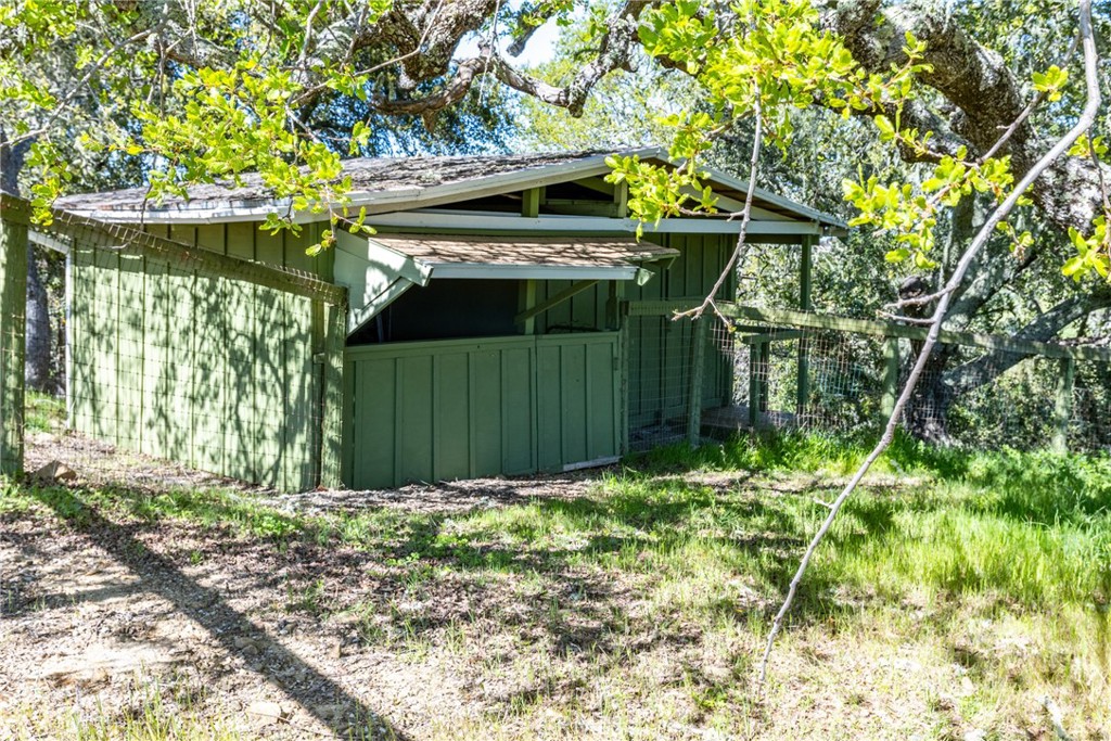 10870 Santa Ana Road Atascadero, CA 93422 - Photo 57 of 67 Connected to the pasture is a nice sized barn. On the left is an open-air room and on the right is a closed room.