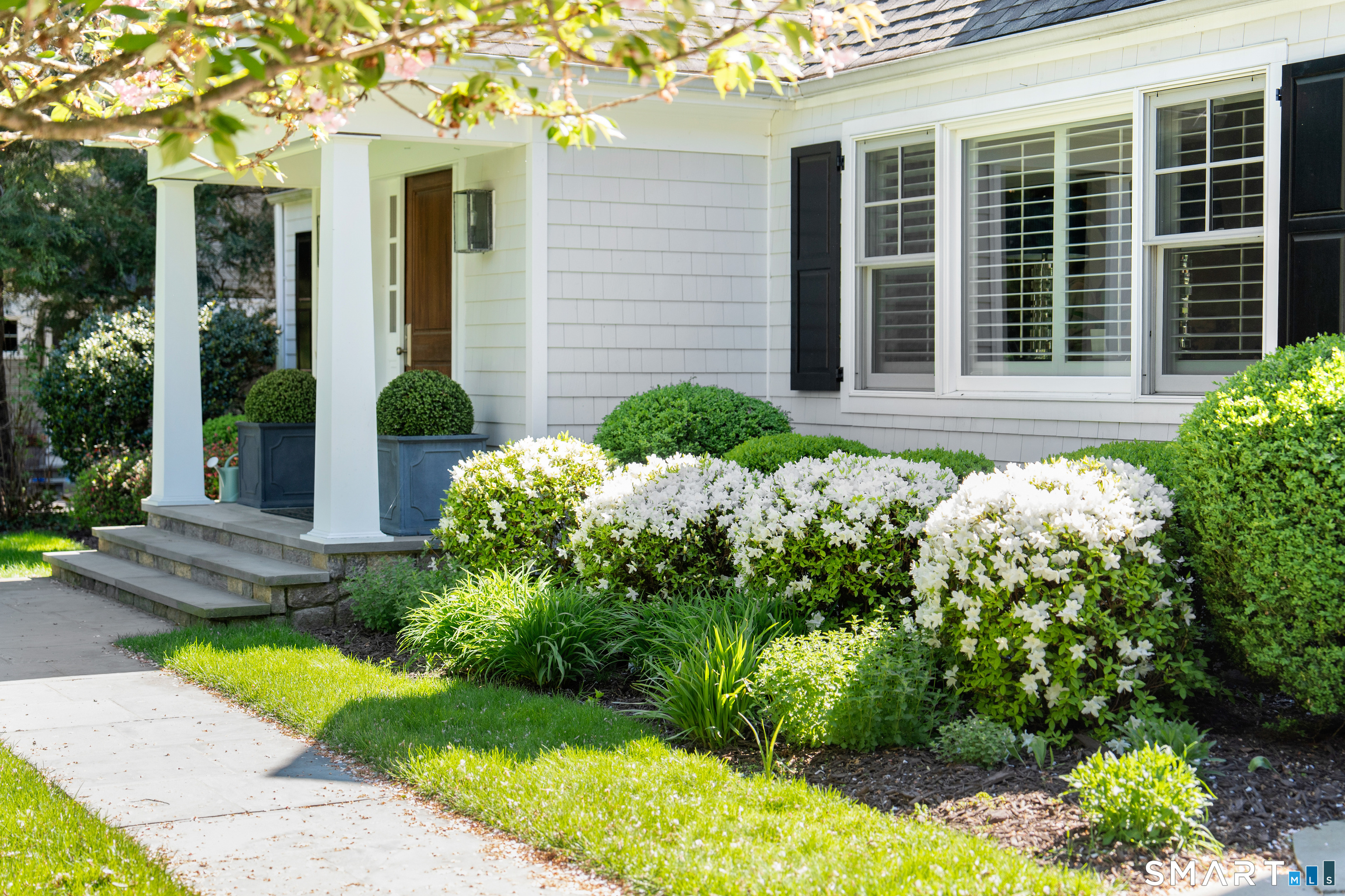 11 McLaren Road South Darien, CT 06820 - Photo 4 of 40 two potted plants in front of a house