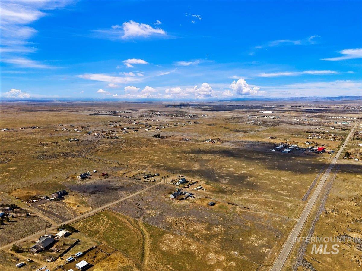 51/ Southwest Smith Rd Mountain Mountain Home, ID 83647 - Photo 9 of 20 Aerial view of sparsely populated area featuring a desert landscape