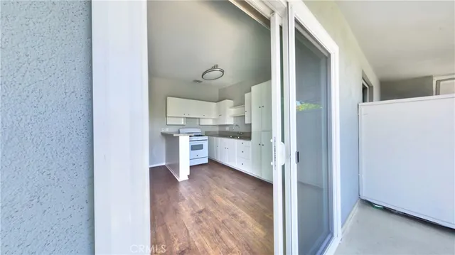 a view of kitchen with wooden floor