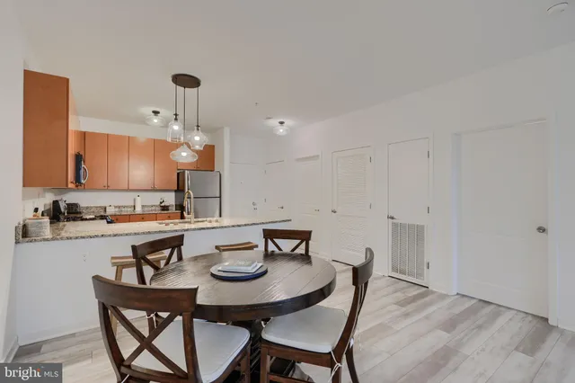a view of a dining room and kitchen