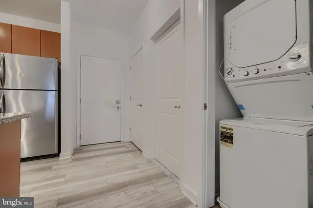 a view of a kitchen with refrigerator