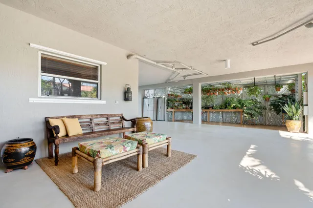 a view of a room with large windows and doors