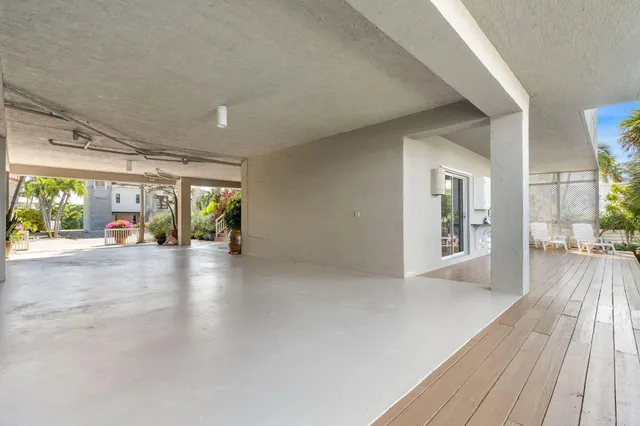 a view of a lake with boats and trees in the background