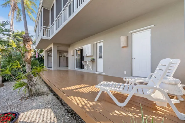 a view of a water fountain and a bench