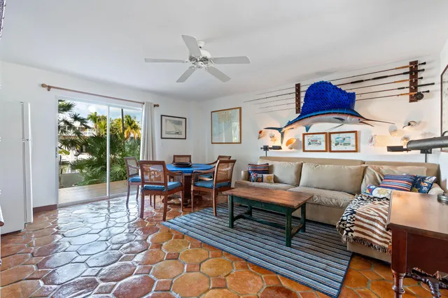 a bedroom with a bed a couch and dresser