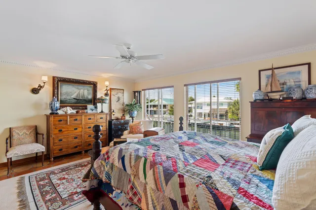 a very nice looking room with a large window and furniture