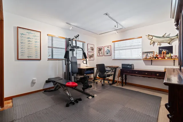 a picture of a bench in front of a wall