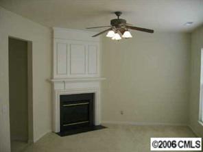 15330 McClure Bridge Road Charlotte, NC 28277 - Photo 3 of 6 a living room with a fireplace