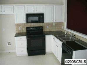15330 McClure Bridge Road Charlotte, NC 28277 - Photo 4 of 6 a kitchen with a sink stove and microwave