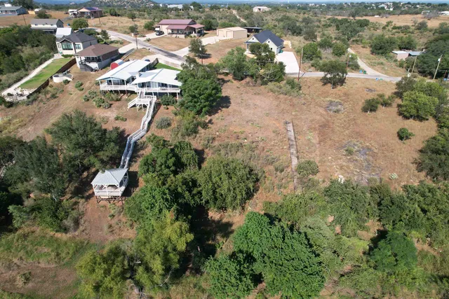 an aerial view of residential house with outdoor space