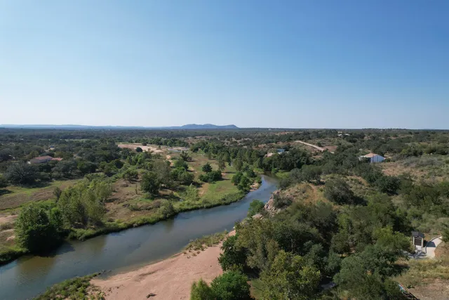 an aerial view of residential house with outdoor space