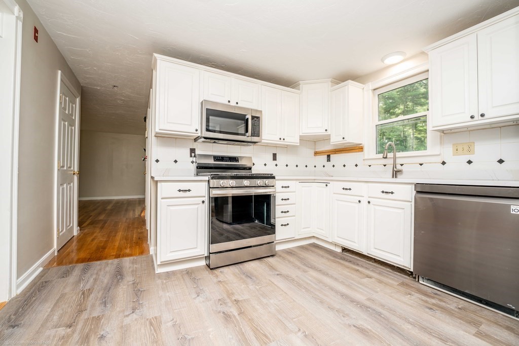 1 Canterberry Path Carver, MA 02330 - Photo 11 of 40 a kitchen with a stove a sink and a microwave