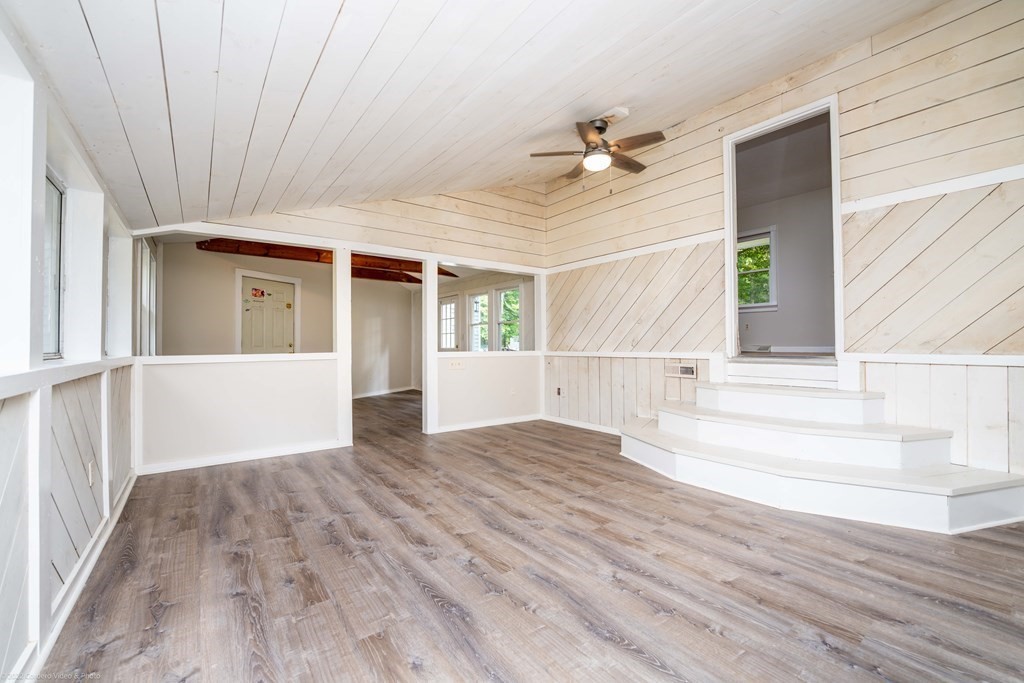 1 Canterberry Path Carver, MA 02330 - Photo 20 of 40 a view of empty room with wooden floor and fan