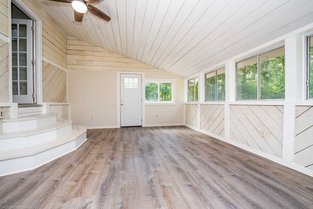 1 Canterberry Path Carver, MA 02330 - Photo 21 of 40 an empty room with wooden floor and windows