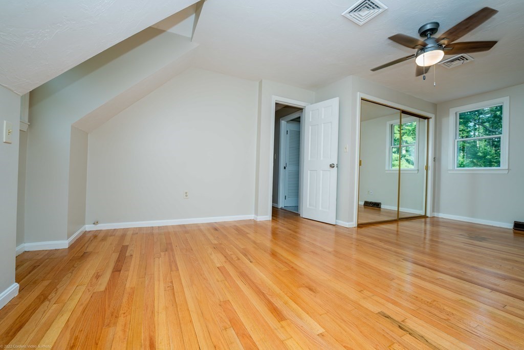 1 Canterberry Path Carver, MA 02330 - Photo 25 of 40 wooden floor in an empty room with a window