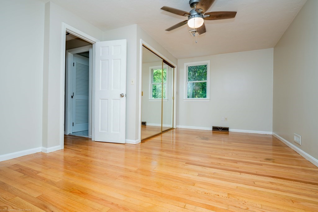 1 Canterberry Path Carver, MA 02330 - Photo 26 of 40 a view of an empty room with window and a ceiling fan